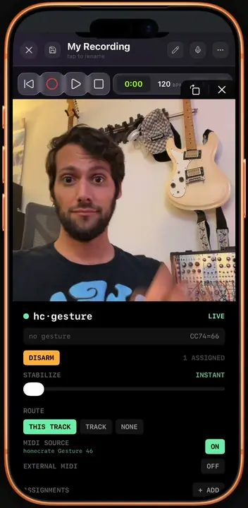A pinch pose tracked on the front camera, sending MIDI CC.